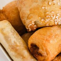Deluxe Box · Full serving of puff puff, 2 of the following: fish rolls, beef rolls, spring rolls, and cho...