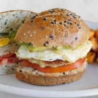 Egg & Chicken Sausage Sandwich* · manchego, organic tomato, smashed avocado & sweet potato hash