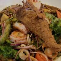 Yam Ta Lay · Shrimp, squid, fish, and scallops marinated in lime juice and mixed with Thai peppers , lemo...