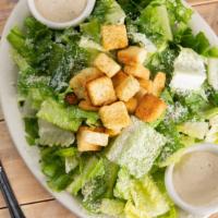 Caesar Salad · A true classic with romaine lettuce, croutons, grated parmesan cheese, and caesar dressing.