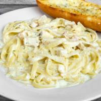 Fettuccine Alfredo With Chicken · Fettuccine tossed in our creamy alfredo sauce and topped with chicken.