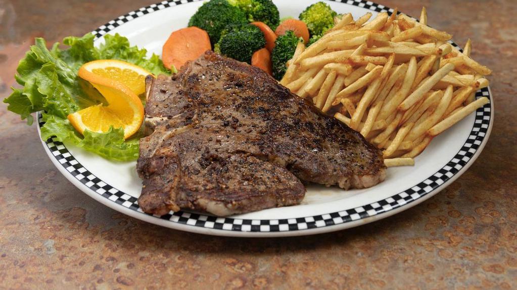14 Oz Usda Choice Porterhouse Steak Dinner · A huge 14 oz USDA Choice Porterhouse steak, cooked to order, served with seasonal vegetables and your choice of side (which includes our new housemade creamy Mac & Cheese for a limited time).