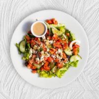 Greek Town Salad · Tender hearts of romaine tossed with a Greek oregano vinaigrette, topped with creamy feta ch...