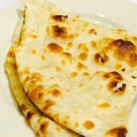 Naan · A traditional leavened white bread.