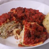 Lasagna · Our famous Lasagna with layers of ground beef, pasta, broccoli, and cheese, covered in rich ...