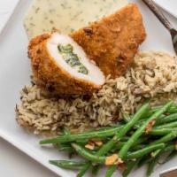 Texas Pecan Crusted Chicken · Pecan crusted chicken breast stuffed with a spinach and artichoke blend served over a lemon ...