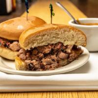 Sliced Beef Brisket · Sliced Brisket Sandwich, Grilled Bun, and our famous Barbecue Inn Barbecue Sauce.