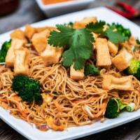 Tofu Stir-Fired Egg Noodle · Stir with Tofu, Broccoli, Bean Sprout and Carrot. 
Topping: Onion, Cilantro and Frid Onion