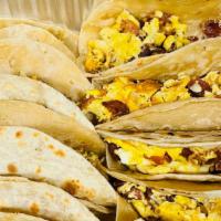 Breakfast Tacos (Single Tacos) · CHOOSE YOUR MEAT
BACON AND EGG
SAUSAGE AND EGG
POTATOES AND EGG
CHORIZO AND EGG