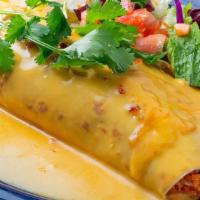 The Most Delicious Donkey · Large flour tortilla filled with shredded chicken, whole pinto beans, rice. Topped with chil...