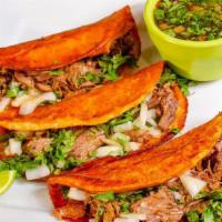 Birria Tacos · Three tacos filled with birria beef, cheese, onions and cilantro. Served with birria broth t...