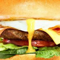 Street Burger · American cheese, ham, fried egg, lettuce and tomato.