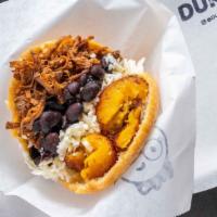 Pabellón Arepa · Shredded beef, black beans, sweet plantains and Fresco cheese.
