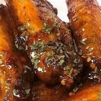 App Jerk Wings · Chicken wings fried and glazed with one of our specialty sauces: Jerk, Mango Jerk, or Jerk BBQ