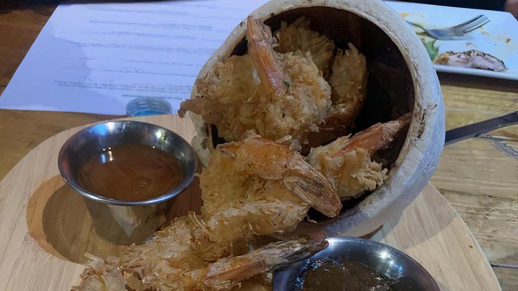 Coconut Shrimp · Jumbo shrimp coated in a delicious coconut batter, fried flaky and golden and served with our special sweet and spicy sauce