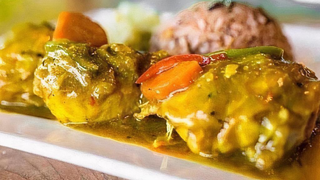 Curry Chicken · Bone-in chicken, marinated and cooked to perfection in authentic Jamaican curry