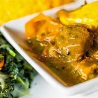 Curry Goat · Tender goat meat seasoned with our authentic Jamaican curry and simmered in a smooth sauce