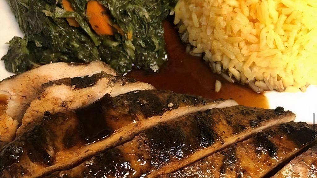 Jerk Chicken Breast · Tender chicken breast, marinated over 24 hrs in TIS Jerk seasoning and grilled on our wood fire grill. Served with our specially made sauce: jerk or jerk Bar-B-Q
