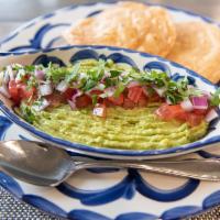 Guacamole De La Casa · Traditional dip made with mashed avocados. Topped with diced tomato, onions and cilantro. Se...
