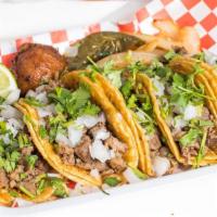 5  Tacos Nuevo Leon  · Five small corn tortillas served with your choice of protein, cilantro & onion. Sides includ...