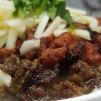 Charro Beans El Barbon · 16 oz charro beans, mixed with marinated sliced pork, beef steak and Monterrey cheese. 
16 o...