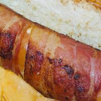 Hot Dog · A bacon-wrapped hot dog.  Sides included: mustard, ketchup, mayonnaise and a bag of potato c...