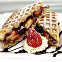Waffle Panini  · Two square waffle stuffed strawberry and blueberry and banana with a rich nutella chocolate