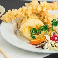 Ebi Tempura · Deep-fried battered shrimp and vegetables and served with tempura sauce.