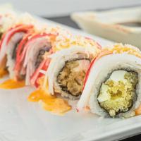 Shaggy Dog Roll · Shrimp tempura with cream cheese inside. Topped with crab meat, crunch and spicy sauce.