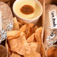 Boxed Lunch · Choose two tacos and your choice of chips & queso or Mexican street corn.