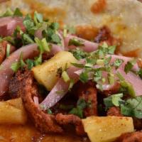 Pastor Pork · Grilled marinated pork, grilled pineapple, pickled red onions, fresh cilantro, toasted cheese.