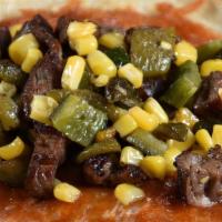 Carne Asada · Grilled chopped steak, sautéed corn, poblano peppers, toasted cheese, refried pinto beans.