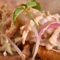 Baja Shrimp · Breaded shrimp, refried pinto beans, shredded marinated cabbage, chipotle mayo, flour tortil...