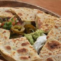 The Quesadillas · Filled with grated cheese, and served with pico de gallo, fresh sour cream, and guacamole.