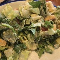 Caesar Salad · Mixed greens, avocado, tomato, caesar dressing, Parmesan cheese.