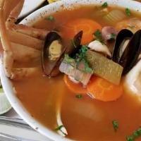 King Soup · King crab, scallops, shrimp, mussels, fillet, pulpo and cilantro.
