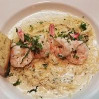 Shrimp Scampi · Sautéed Compass shrimp and mushrooms in a creamy garlic butter sauce. Served over angel hair...