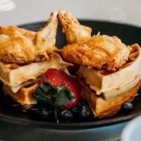 Chicken And Waffles · Chicken marinated and seasoned with secret spices, served on a Belgian waffle with hot syrup...