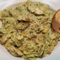 Chicken Pesto Pasta · Sliced grilled chicken tossed in our house-made creamy pesto sauce. Served over bowtie pasta.