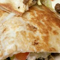 Giant Burrito Dinner · Your choice of meat and the burrito comes with lettuce, tomato, sour cream, and cheese. Serv...