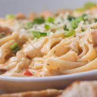 New Orleans Pasta · Fettuccine noodles, shrimp, crawfish tails, andouille sausage and fresh veggies tossed in a ...