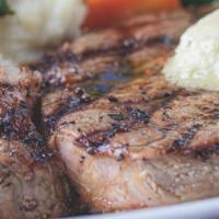 Ribeye Steak · 12 oz hand cut Angus ribeye steak served with your choice of two sides.