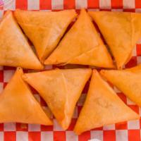 Beef Samosas (4) · A delicious crispy shell stuffed with ground beef and exotic spices with a green sauce made ...