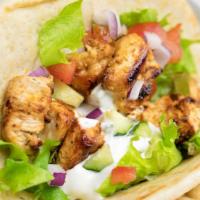 Chicken Gyro · Greek chicken gyros with tzatziki sauce wrapped in a toasted pita bread with a delicious sal...