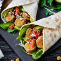Falafel Wrap · Falafels paired with a delicious Mediterranean salad with nutty tzatziki sauce wrapped in a ...