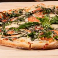 Pizza Margherita · Olive oil, garlic, fresh tomatoes, fresh basil, shredded Parmesan and mozzarella cheese.