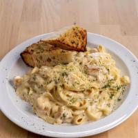 Baked Chicken Alfredo · Fettuccini and chicken baked in a cream sauce.
