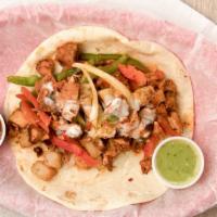 Chicken Fajita · Grilled chicken fajita, grilled onions & bell peppers, roasted potatoes, topped with queso, ...