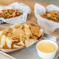 Queso & Chips · Homemade chips & our classic queso.