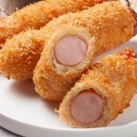 Cheddar Cheese Hot Dog · A hot dog with sausage wrapped in creamy cheddar cheese.